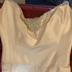 The beauty of this exquisite satin wedding gown is the simplicity.